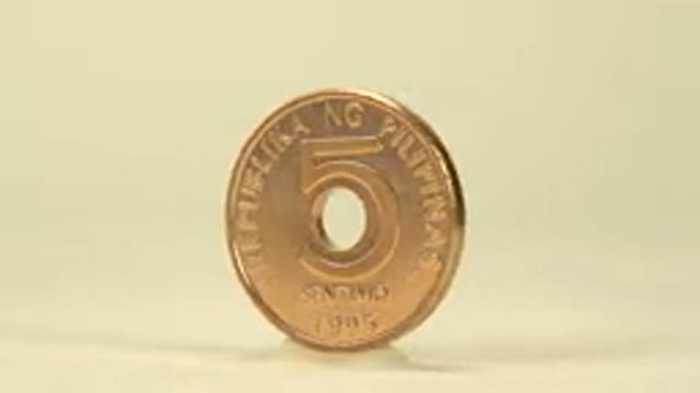 Coin Being Rotated On A Platform
