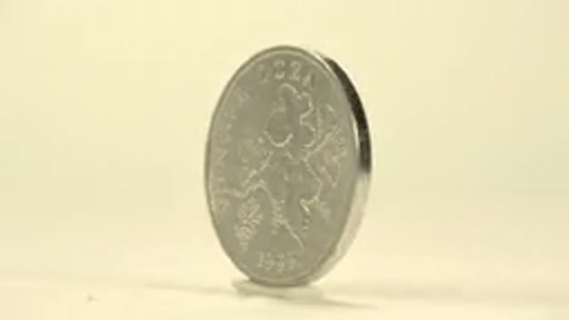 Display Of A Silver Coin With A Number Rotating Very Shiny