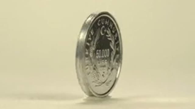 Spinning Silver Coin Marked Lira