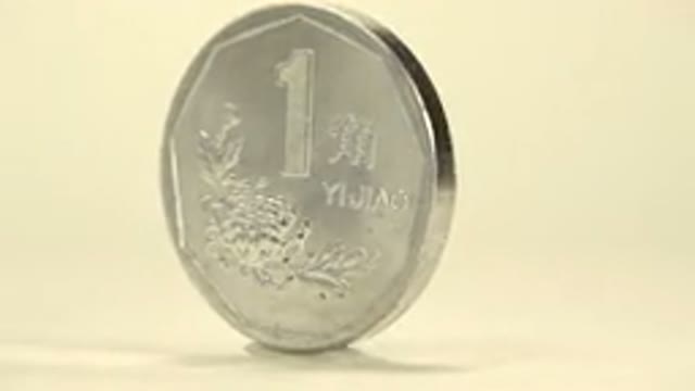 Silver Coin That Is Rotating On A Special Platform And Is Shining In The