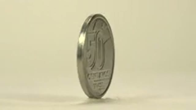 Gold Coin On Its Axis Pining In Slow Motion Foreign Language