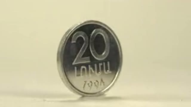 A Coin Rotating On Its Edge