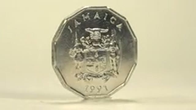 Jamaican Coin On A Turning Pedestal