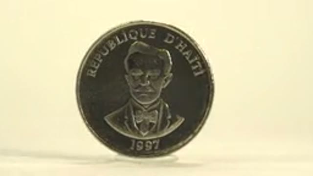 Close Up Shot Of A Rotating Silver Coin