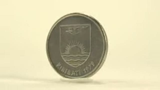 A Coin Rotating With The Words Cents Engraved