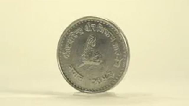 Silver Colored Coin Rotating Around And Around Not Sure What Coin This Is