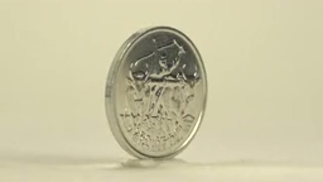 Coin With A Lion Image On One Side And A Bull Image On The Other