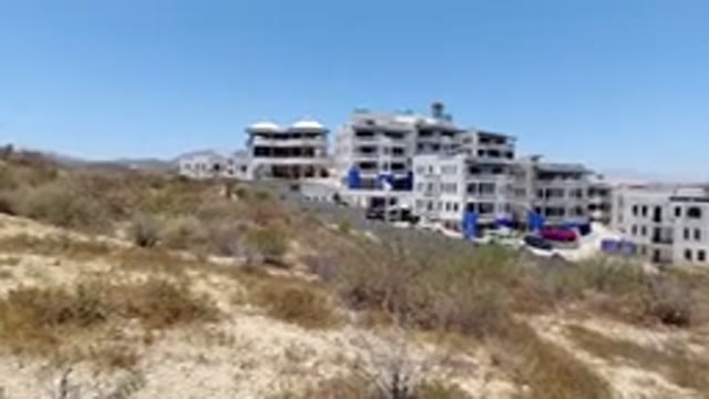 SAN JOSE DEL CABO MEXICO-2020: Some Big Grey Buildings With A City In The Background