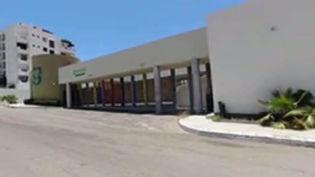 SAN JOSE DEL CABO MEXICO-2020: A Modern Concrete Structure Next To A Parking Lot