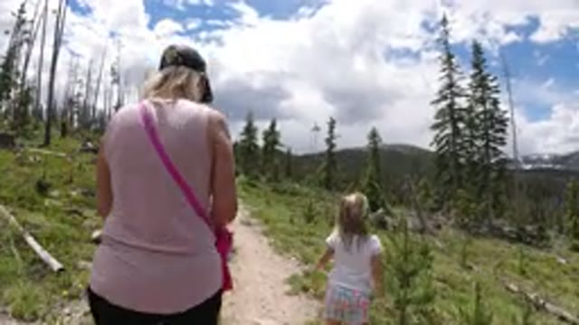 WINTER PARK COLORADO-2019: Mom And Daughter Walking Up The Hill In The Woods