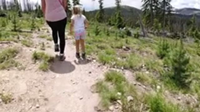 WINTER PARK COLORADO-2019: Woman Small Girl And A Dog Are Seen Walking Along A