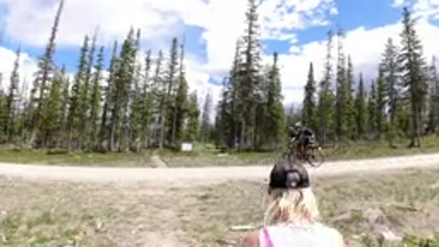 WINTER PARK COLORADO-2019: Little Kids Biking Down A Paved Road With Adults