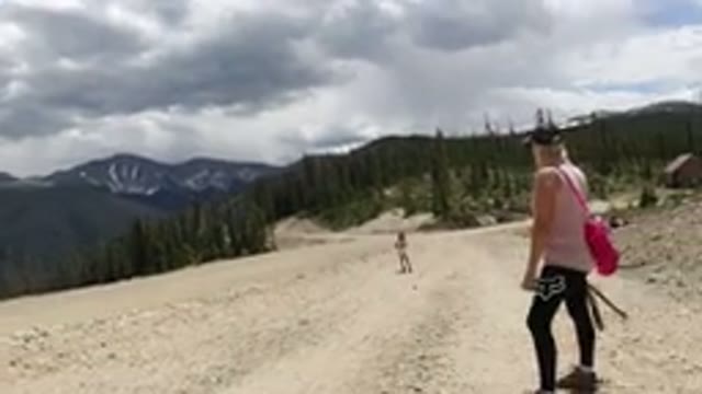 WINTER PARK COLORADO-2019: Family Hiking Up A Rocky Mountain On A Hot Sunny Day
