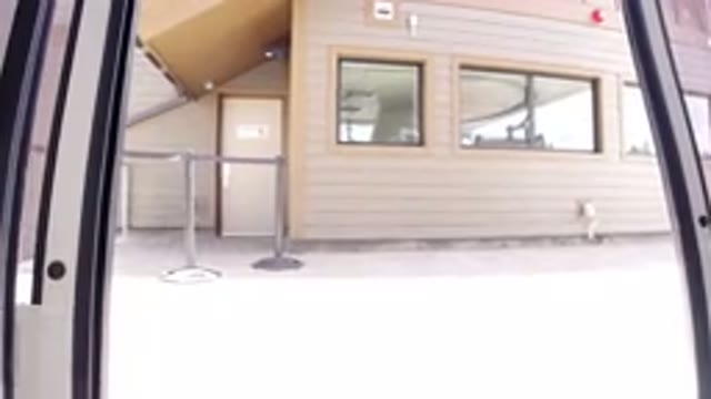 WINTER PARK COLORADO-2019: Camera Inside A Bus Parking Showing A Yellow House