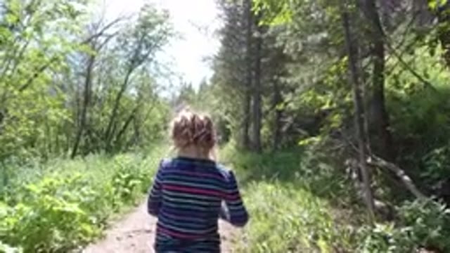 WINTER PARK COLORADO-2019: Child Walking With His Dog And Family On A Dirt Path