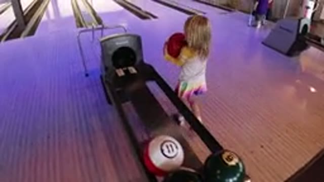 WINTER PARK COLORADO-2019: A Kid Is Holding A Bowling Ball Ready To Roll