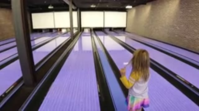 WINTER PARK COLORADO-2019: Parent Playing With Daughter In The Bowling Station