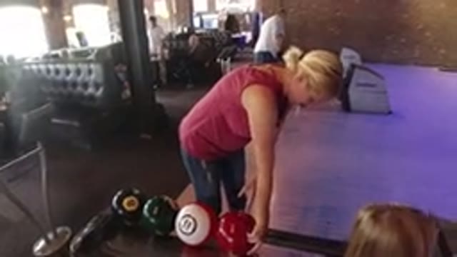 WINTER PARK COLORADO-2019: A Woman Taking Her Turn In A Game Of Bowling