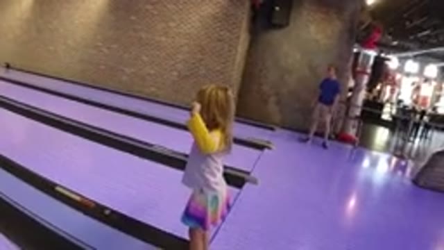 WINTER PARK COLORADO-2019: Little Girl Celebrating After Rolling A Bowling Ball