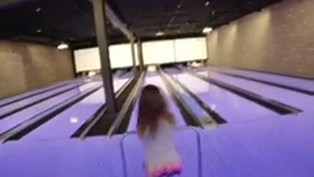 WINTER PARK COLORADO-2019: A Small Girl Is Bowling On The Floor