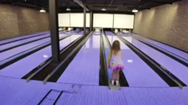 WINTER PARK COLORADO-2019: Girl Playing Bowling and Hoping the Pins Fall