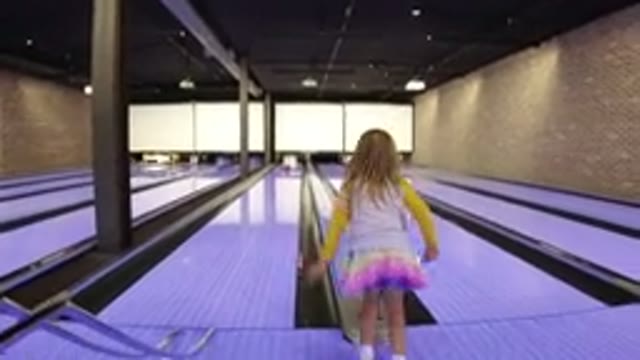 WINTER PARK COLORADO-2019: Little Girl Bowling Strike with Perfect Score