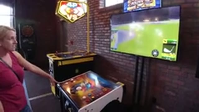 WINTER PARK COLORADO-2019: Blonde Woman Comments On A Golf Video-game On A