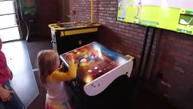 WINTER PARK COLORADO-2019: Child Playing In The Arcade With Mom's Supervision