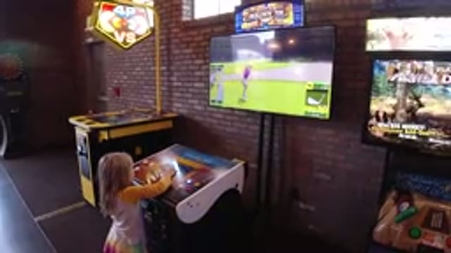 WINTER PARK COLORADO-2019: Girl Playing Game Alone on Two TV Screens
