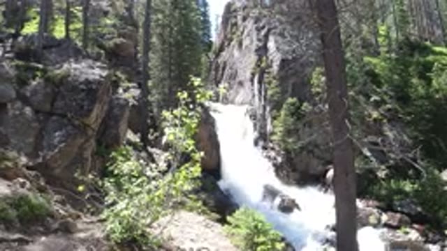 WINTER PARK COLORADO-2019: Beautiful Waterfall Flowing Gracefully Through The Woods
