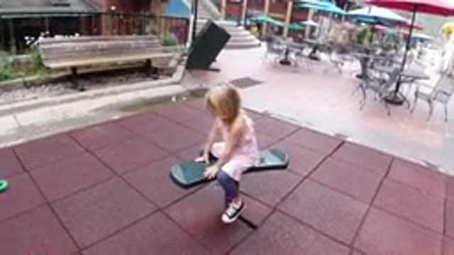 WINTER PARK COLORADO-2019: Little Girl Playing On A Bouncy Seat That Is Swaying