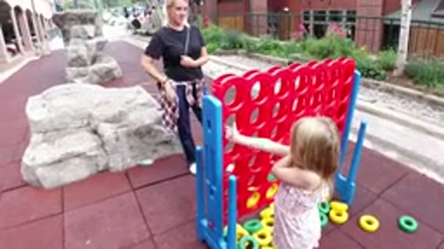 WINTER PARK COLORADO-2019: A Small Girl Playing With Her Mom
