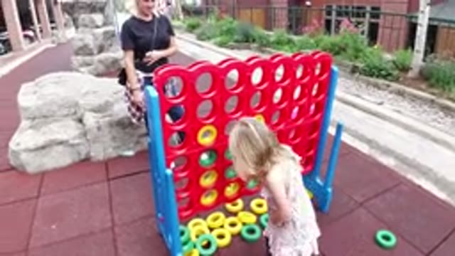 WINTER PARK COLORADO-2019: Girl Playing A Game On A Playground Having Fun