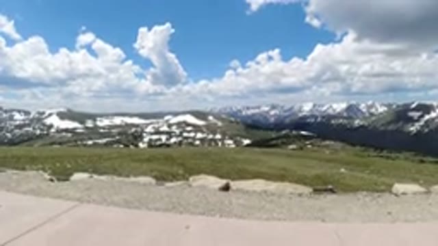 WINTER PARK COLORADO-2019: A Girl In A Blue Shirt Walks On The Sidewalk On Top
