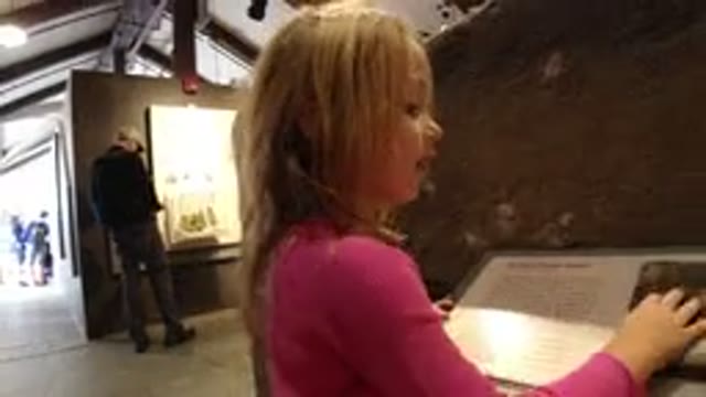 WINTER PARK COLORADO-2019: Young Blonde Girl Looking At Geological Rock Sample