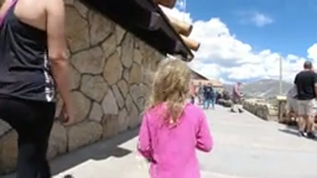 WINTER PARK COLORADO-2019: Tourist Child Walking Beside Companion in Tourist Area