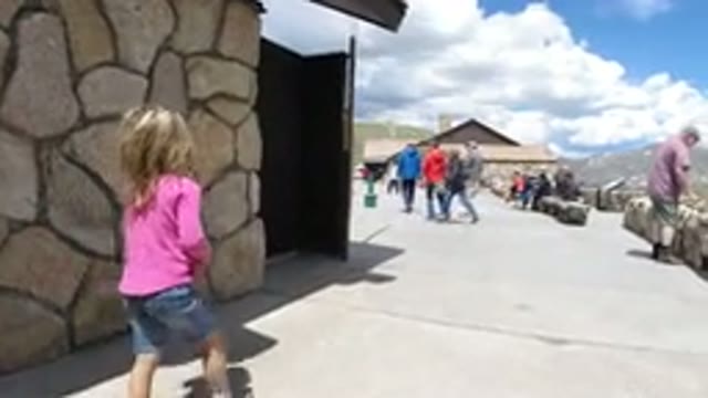 WINTER PARK COLORADO-2019: A Caucasian Hand Indicates Near A Blond Child Walking