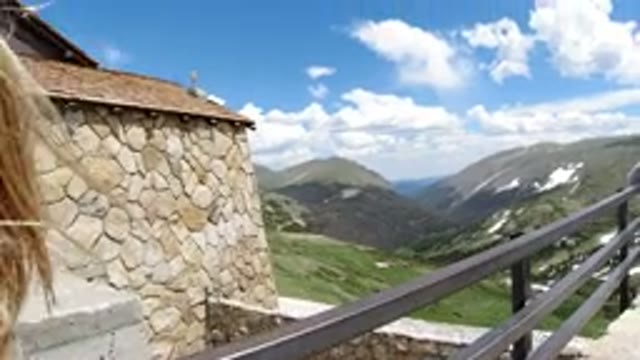 WINTER PARK COLORADO-2019: Child Sitting On A Balcony Overlooking A Spectacular Mountain View