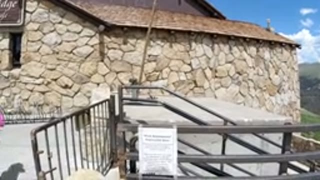 WINTER PARK COLORADO-2019: A View Of A Stone Building With A Kid In The
