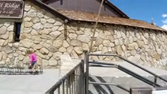 WINTER PARK COLORADO-2019: Child Playing On Bicycle Rack In Rural Area With