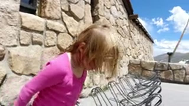 WINTER PARK COLORADO-2019: A Girl Child Trying To Occupy Chairs Arranged