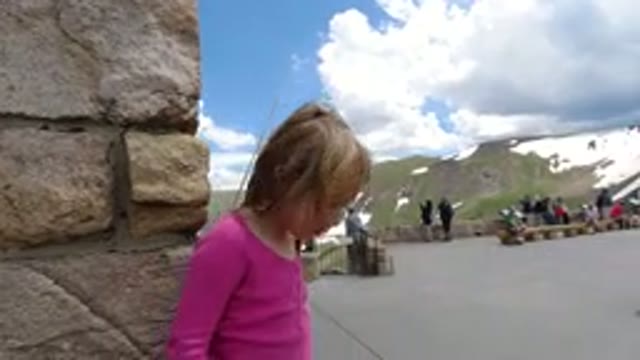 WINTER PARK COLORADO-2019: A Girl Holding a Rope and Talking in a Winter Park