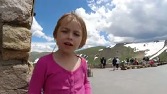 WINTER PARK COLORADO-2019: Little Girl Wrapping Her Finger During a Winter Gathering