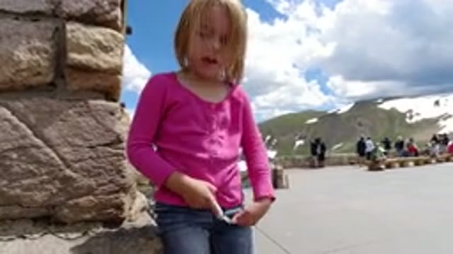 WINTER PARK COLORADO-2019: Cute Little Girl Messing With String In Front Of