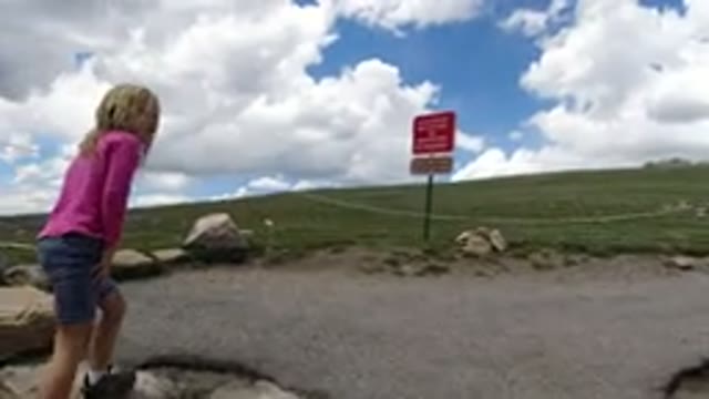 WINTER PARK COLORADO-2019: A Blonde Girl Approaching A Chain That Blocks The