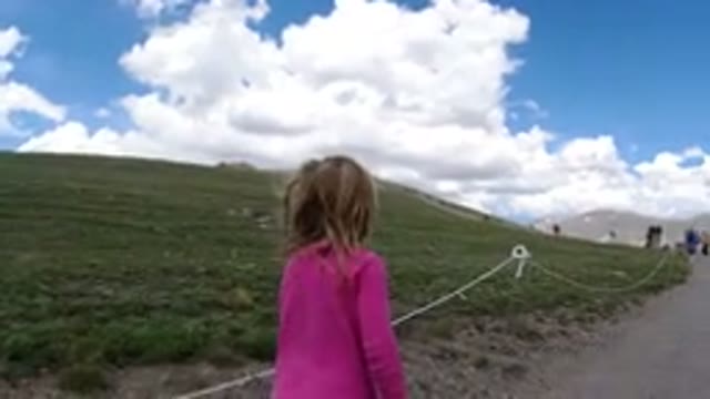 WINTER PARK COLORADO-2019: Young Girl Begins Walking Along Hillside Trail Where
