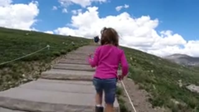 WINTER PARK COLORADO-2019: A Girl Climbing Up Into the Steps