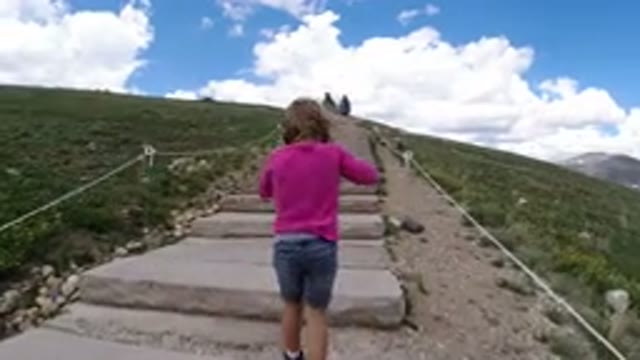 WINTER PARK COLORADO-2019: Little Girl Climbs Stone Stairs in Forest