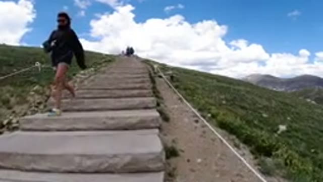 WINTER PARK COLORADO-2019: Little Girl Climbing Stairs in Mountain Scenery