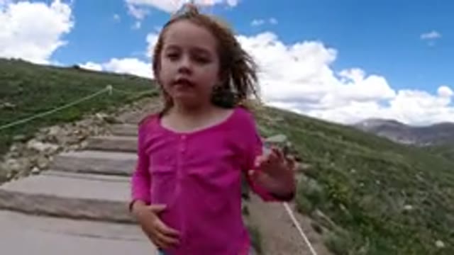 WINTER PARK COLORADO-2019: Young Girl Walking Up Mountain With Family